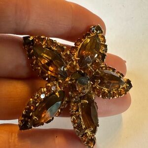 Rhinestone prong set gold tone brooch